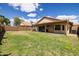 Lush backyard with a covered patio, perfect for enjoying outdoor living and entertaining at 4529 E Thistle Landing Dr, Phoenix, AZ 85044
