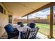 Inviting covered patio with comfortable seating, perfect for outdoor dining and relaxing at 4529 E Thistle Landing Dr, Phoenix, AZ 85044