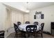 Charming dining area with bay window and seating for six at 4529 E Thistle Landing Dr, Phoenix, AZ 85044