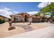 Attractive single-story house with desert landscaping and a spacious two car garage at 4529 E Thistle Landing Dr, Phoenix, AZ 85044