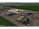 Aerial view of a construction site with the frame of a new home in a rural community at 5905 S 182Nd Ave, Goodyear, AZ 85338