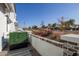 The side patio of the home is adorned with lush greenery and offers views of the neighborhood at 669 E Scenic St, Apache Junction, AZ 85119