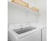 Laundry room with modern washer and dryer and shelving above at 669 E Scenic St, Apache Junction, AZ 85119