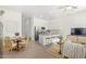 Bright, open-concept living area with modern decor, seamlessly connecting the living, dining, and kitchen spaces at 669 E Scenic St, Apache Junction, AZ 85119