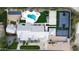 Expansive backyard featuring a pool, sports court, solar panels and recreation areas for outdoor fun at 6718 E Caron Dr, Paradise Valley, AZ 85253