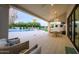 A relaxing back patio area adjacent to a pool and yard at 6718 E Caron Dr, Paradise Valley, AZ 85253