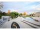 The backyard includes a built in seating area with a fire pit and a pool at 6718 E Caron Dr, Paradise Valley, AZ 85253