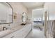 This bright bathroom features a soaking tub, double sink vanity, and modern finishes at 6718 E Caron Dr, Paradise Valley, AZ 85253