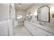 Bright bathroom with double sink vanity, stylish mirrors, and modern finishes at 6718 E Caron Dr, Paradise Valley, AZ 85253