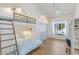 A well-lit bedroom features a bunk bed, window seat, vaulted ceiling, and hardwood floors at 6718 E Caron Dr, Paradise Valley, AZ 85253