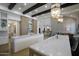 Bright open kitchen featuring double islands, marble counters, and ample cabinetry with seamless flow to the living area at 6718 E Caron Dr, Paradise Valley, AZ 85253