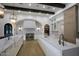 Modern kitchen with marble countertops, dual islands, custom cabinetry, and stainless steel appliances for gourmet cooking at 6718 E Caron Dr, Paradise Valley, AZ 85253