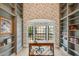 Bright office with a view, built-in shelving, and modern finishes at 6718 E Caron Dr, Paradise Valley, AZ 85253