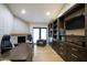 Bright office with a fireplace, built-in shelving, and modern finishes at 6718 E Caron Dr, Paradise Valley, AZ 85253