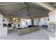 Outdoor living space with fireplace, TV, lounge seating, drinking fountain, and access to the yard at 6718 E Caron Dr, Paradise Valley, AZ 85253