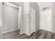 Entryway featuring gray walls, vinyl plank flooring, and white doors at 9259 W Caron Cir, Peoria, AZ 85345
