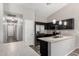 Updated kitchen featuring stainless steel appliances and a modern countertop at 9259 W Caron Cir, Peoria, AZ 85345