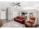 Open concept living room featuring vaulted ceilings, vinyl flooring and gray walls at 9259 W Caron Cir, Peoria, AZ 85345