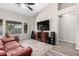 Living room with gray walls, vinyl plank flooring, and large windows at 9259 W Caron Cir, Peoria, AZ 85345