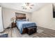 Comfortable main bedroom featuring ceiling fan and a large window at 9259 W Caron Cir, Peoria, AZ 85345