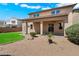 Backyard features a covered patio overlooking a well-maintained yard at 12217 W Planada Ln, Sun City, AZ 85373