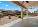 Backyard features a covered patio overlooking a well-maintained yard at 12217 W Planada Ln, Sun City, AZ 85373