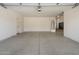 Spacious garage with epoxy flooring and overhead lighting at 12217 W Planada Ln, Sun City, AZ 85373