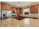 Stylish kitchen with stainless steel appliances, granite countertops, and ample storage space at 12217 W Planada Ln, Sun City, AZ 85373