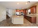 The kitchen features stainless steel appliances, granite countertops, and an island at 12217 W Planada Ln, Sun City, AZ 85373