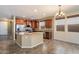 Open kitchen with stainless steel appliances, granite countertops, and a large island at 12217 W Planada Ln, Sun City, AZ 85373