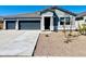 Charming single-story home featuring a two-car garage, desert landscaping, and neutral paint scheme at 12473 E Bahia Ct, Florence, AZ 85132
