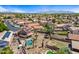 Aerial view of neighborhood with lush landscaping, mature trees, many pools and well-kept properties at 12745 W Monte Vista Rd, Avondale, AZ 85392
