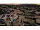 Spacious backyard with a sparkling pool, covered patio, lush landscaping, and solar panels that make the property eco-friendly at 12745 W Monte Vista Rd, Avondale, AZ 85392