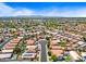 Aerial view of the neighborhood showcasing a mix of homes, landscaping, pools, and roads at 12745 W Monte Vista Rd, Avondale, AZ 85392