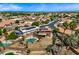 Aerial shot of a backyard featuring a pool, solar panels, pergola and mature landscaping at 12745 W Monte Vista Rd, Avondale, AZ 85392