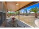 Expansive backyard with covered patio, desert landscaping, and block wall fencing for privacy at 12745 W Monte Vista Rd, Avondale, AZ 85392