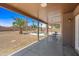 Backyard features a covered patio, desert landscaping, pool, privacy fence and patio furniture at 12745 W Monte Vista Rd, Avondale, AZ 85392