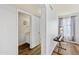 Half bathroom with laminate floors, with a view to the laundry area, providing convenient functionality at 12745 W Monte Vista Rd, Avondale, AZ 85392