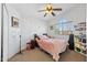 Bedroom with closet doors, carpet, a ceiling fan, and ample natural light at 12745 W Monte Vista Rd, Avondale, AZ 85392