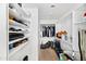 Walk-in closet offering ample storage with shelving, hanging rods, and carpeted floors at 12745 W Monte Vista Rd, Avondale, AZ 85392