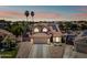 Inviting two-story home boasting a red-tile roof, solar panels, and well-manicured landscaping for a desirable curb appeal at 12745 W Monte Vista Rd, Avondale, AZ 85392