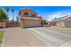 Inviting two-story home with a spacious driveway, two car garage and a well maintained lawn for an attractive curb appeal at 12745 W Monte Vista Rd, Avondale, AZ 85392