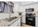 Bright kitchen featuring stainless steel appliances, granite countertops, and subway tile backsplash at 12745 W Monte Vista Rd, Avondale, AZ 85392