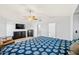 A bright main bedroom boasts vaulted ceilings, large bed, and a ceiling fan at 12745 W Monte Vista Rd, Avondale, AZ 85392