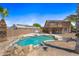 Backyard pool featuring an in-ground pool, desert landscaping, and covered patio at 12745 W Monte Vista Rd, Avondale, AZ 85392