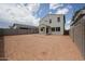 Large backyard with block fence and potential for landscaping and outdoor living space at 2557 E Music Mountain Ave, Apache Junction, AZ 85119