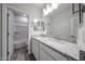 Modern bathroom features double sinks, granite countertops, and a shower/tub combo at 2557 E Music Mountain Ave, Apache Junction, AZ 85119