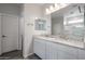 Bathroom with dual sinks, granite counters, framed mirrors, and tile flooring at 2557 E Music Mountain Ave, Apache Junction, AZ 85119