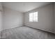 Bedroom featuring neutral walls, plush carpet, and a large window providing ample natural light at 2557 E Music Mountain Ave, Apache Junction, AZ 85119