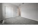 Bedroom featuring neutral walls, plush carpet, closet, and a doorway leading to the rest of the home at 2557 E Music Mountain Ave, Apache Junction, AZ 85119